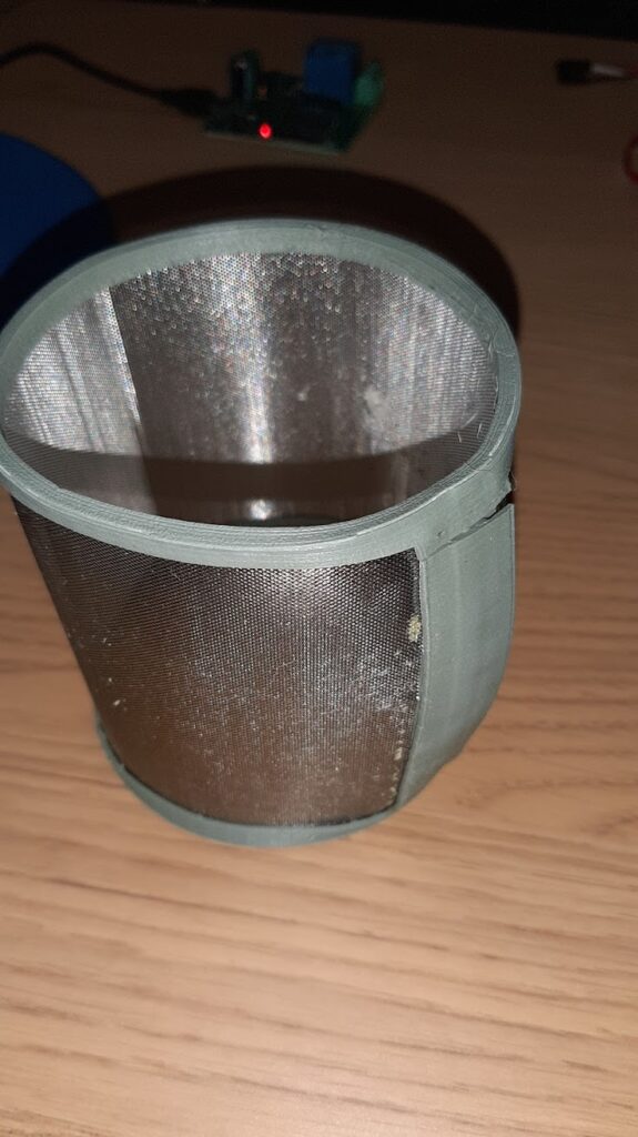 dishwasher filter enclosure printed with gray-green pla