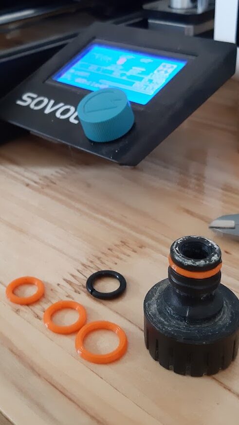 3 tpu gaskets on  the table, hose connector nearby