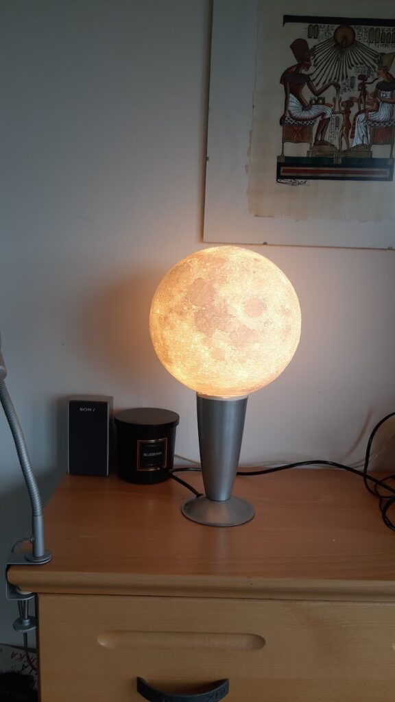 moon lamp assembled, on a wooden cabinet